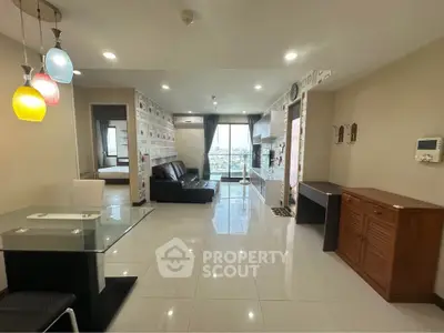 Spacious modern living room with stylish lighting and city view, perfect for urban living.