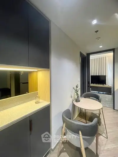 Modern apartment interior with sleek dining area and stylish cabinetry