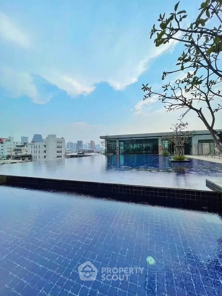 Stunning rooftop pool with panoramic city views and modern architecture.
