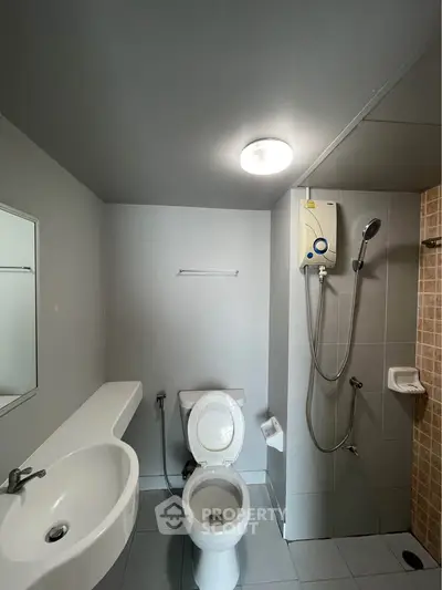Modern bathroom with sleek fixtures and shower, ideal for contemporary living.