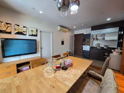 Spacious living room with modern kitchen and elegant dining area, perfect for family gatherings.