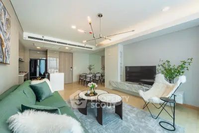 Luxurious modern living room with stylish decor and open layout, featuring elegant furniture and natural lighting.