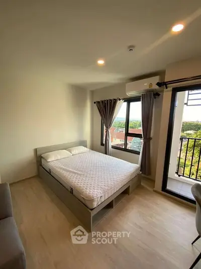 Modern bedroom with balcony and scenic view in a stylish apartment