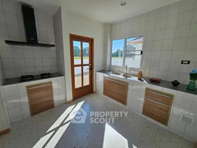 Modern kitchen with sleek design and natural light