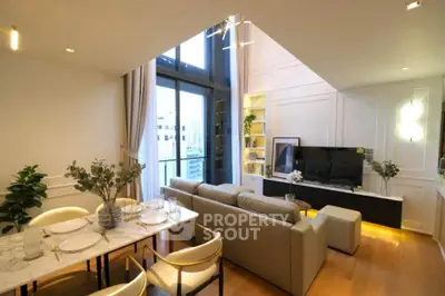 Luxurious modern living room with high ceilings and elegant decor