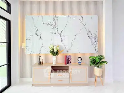 Stylish modern living room with elegant marble wall art and chic decor