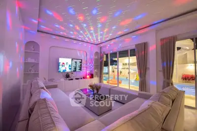 Luxurious living room with ambient lighting and pool view, perfect for entertainment and relaxation.