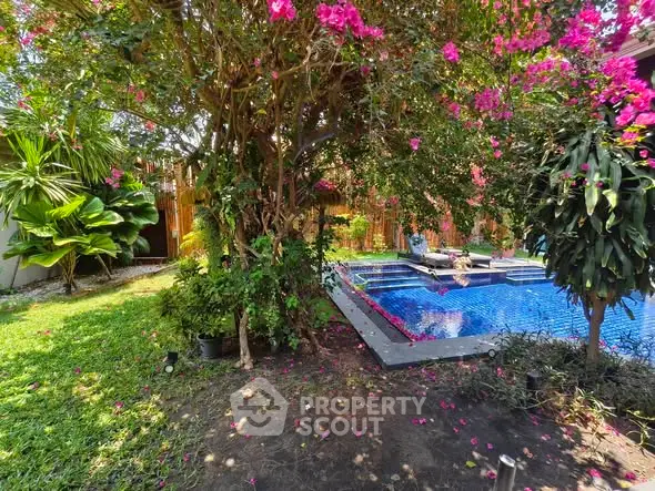 Luxurious garden with vibrant flowers and a sparkling pool, perfect for relaxation and outdoor enjoyment.