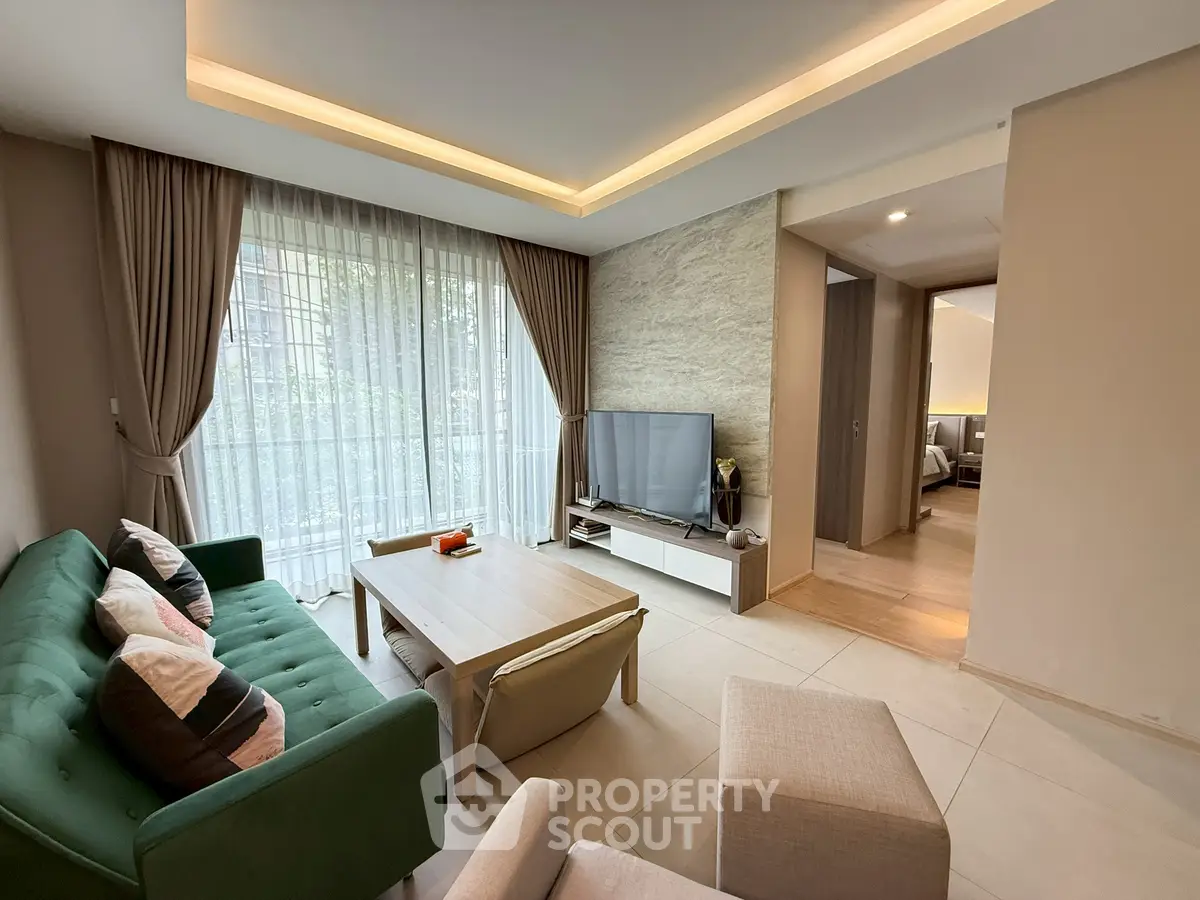 Spacious living room with modern decor and natural light