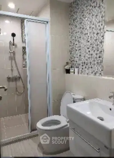 Modern bathroom with sleek shower and stylish tile design