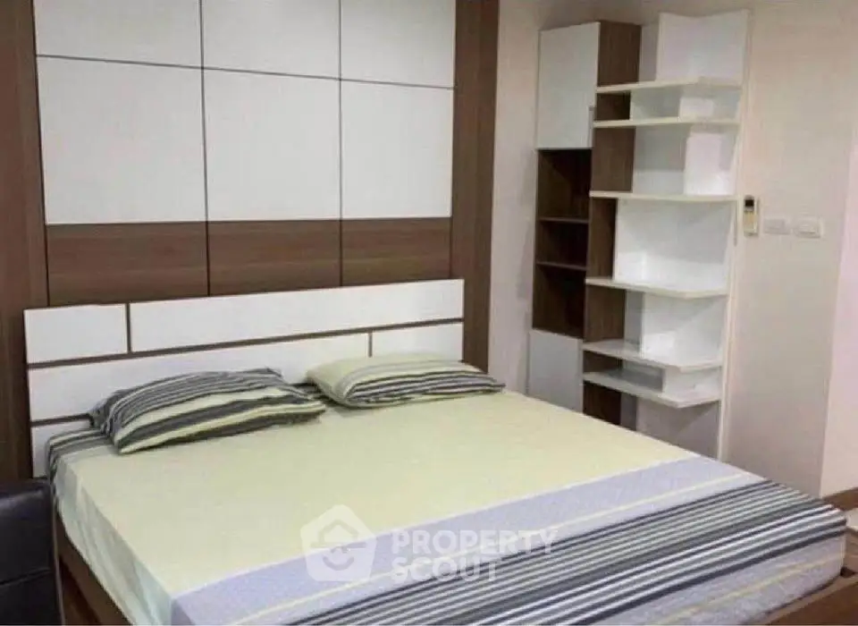 Modern bedroom with stylish shelving and contemporary design