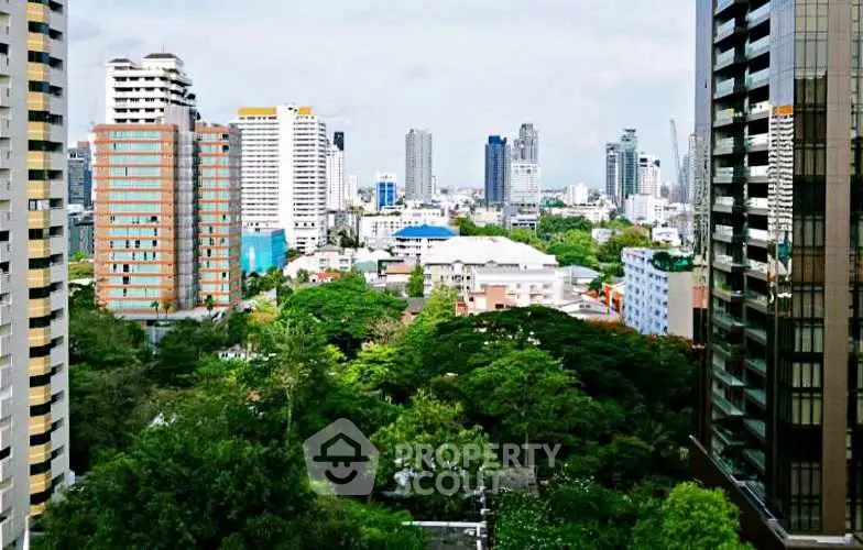 Stunning cityscape view with lush greenery and modern high-rise buildings.