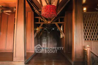 Stunning wooden interior hallway with unique lighting and intricate design elements.