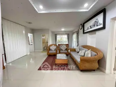 Spacious living room with elegant wicker furniture and modern decor