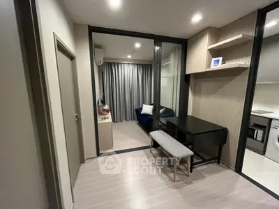 Modern apartment interior with study area and view into living room