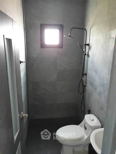 Modern minimalist bathroom with sleek shower and compact design