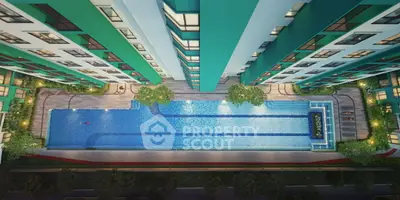 Stunning aerial view of modern apartment complex with luxurious swimming pool and lush greenery.