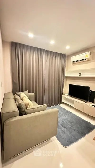 Modern living room with cozy sofa and sleek entertainment setup