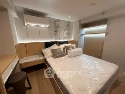 Luxurious modern bedroom with elegant marble accents and cozy lighting