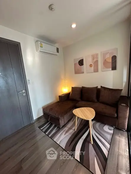 Cozy living room with modern decor and comfortable brown sofa