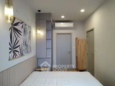 Modern bedroom with stylish decor and air conditioning unit