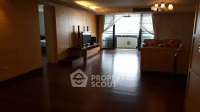 Spacious living room with hardwood floors and modern decor