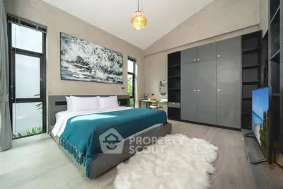 Luxurious modern bedroom with stylish decor, large windows, and elegant furnishings.