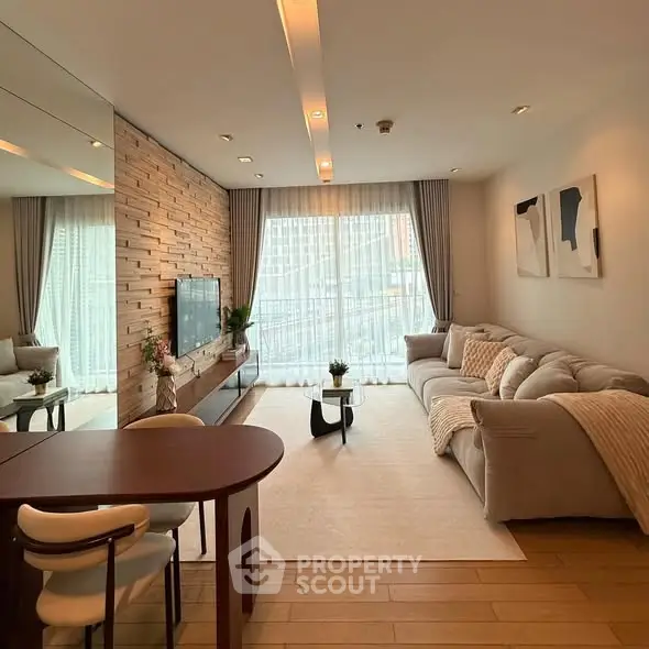 Modern living room with stylish decor and large windows for natural light.