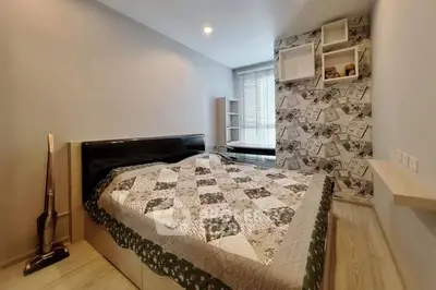 Cozy bedroom with stylish decor and ample natural light