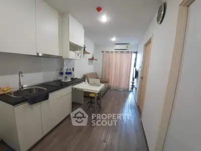 Modern compact kitchen with open layout and cozy living area