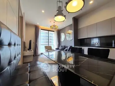Luxurious modern living room with sleek black furniture and large windows offering city views.