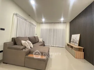 Modern living room with sleek furniture and ambient lighting
