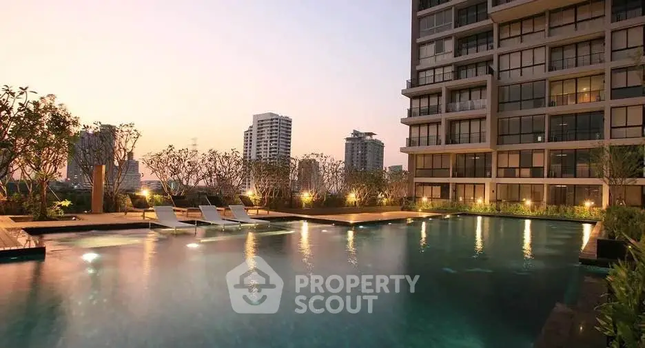 Luxurious rooftop pool with stunning city skyline views at sunset