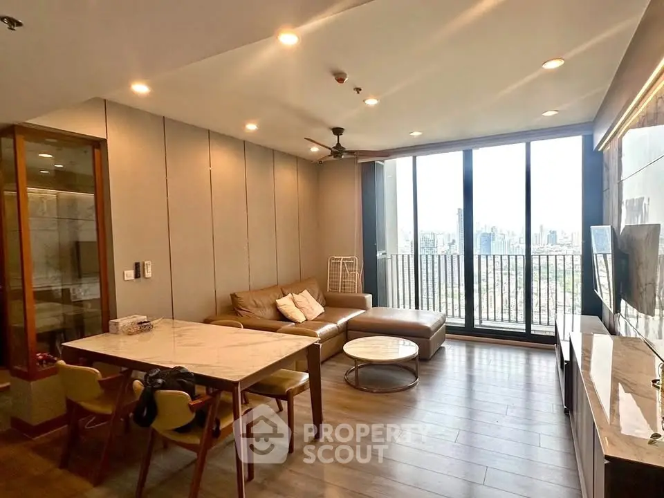 Spacious modern living room with city view and elegant furnishings