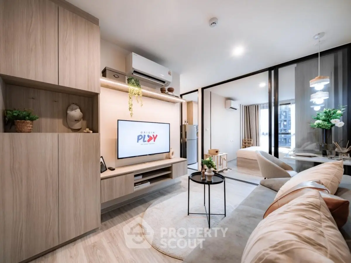 Modern living room with stylish decor and open layout, featuring cozy seating and contemporary design.
