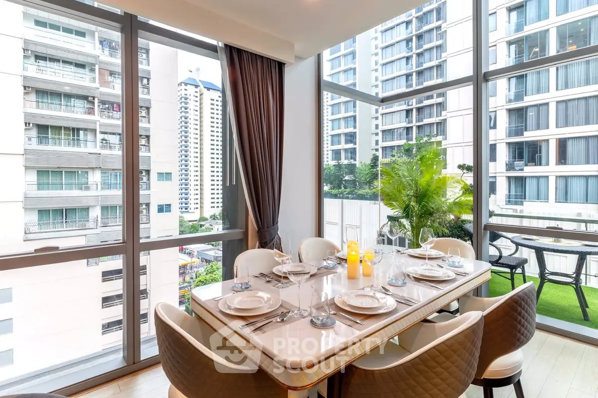 Elegant dining area with city view and large windows in modern apartment