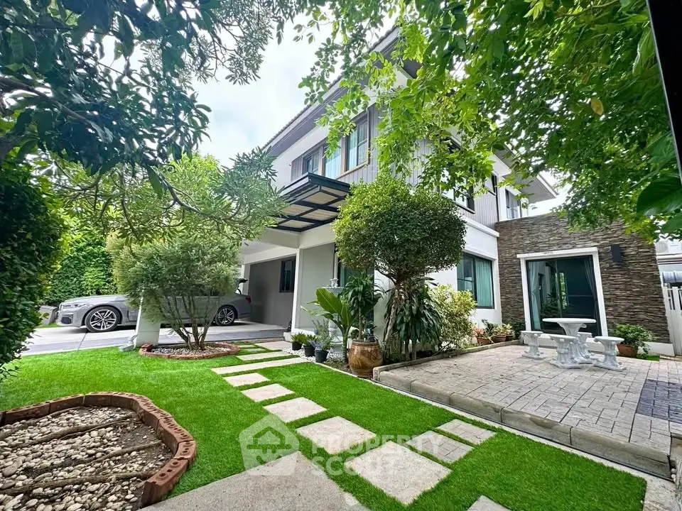 Charming modern house with lush garden and driveway, perfect for family living.