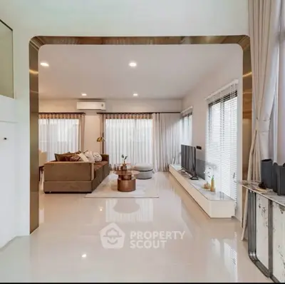 Spacious modern living room with elegant decor and large windows