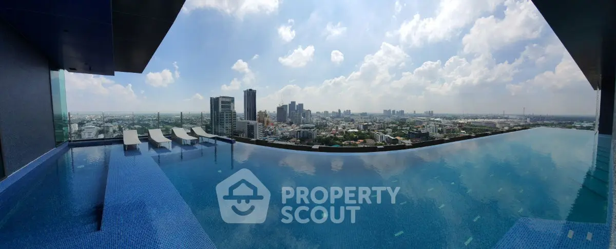 Stunning rooftop infinity pool with panoramic city skyline view