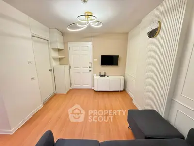 Modern living room with stylish lighting and wall-mounted TV