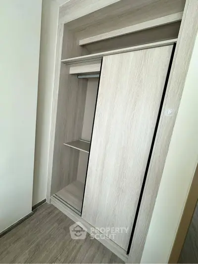 Modern built-in wardrobe with sliding doors in a stylish apartment