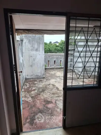 Spacious balcony with potential for renovation and outdoor living space.