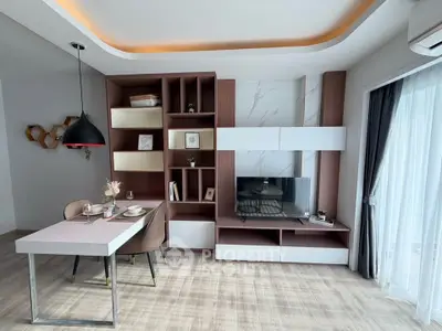Modern living room with stylish shelving and dining area, featuring elegant decor and natural light.