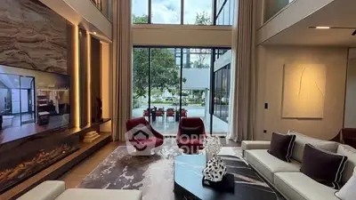 Luxurious modern living room with high ceilings and large windows
