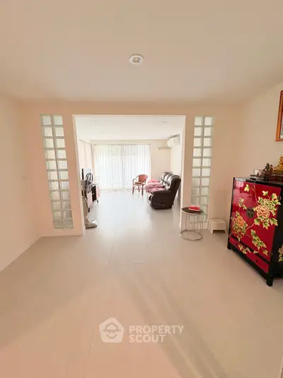 Spacious living room with elegant decor and natural light