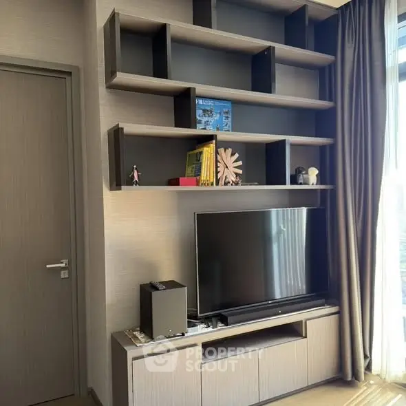 Modern living room with sleek TV unit and stylish shelving
