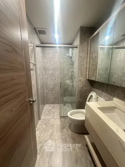 Modern bathroom with sleek design and glass shower enclosure