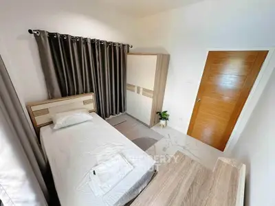 Cozy bedroom with modern furnishings and natural light