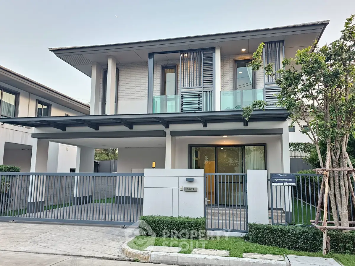 Modern two-story house with sleek design and spacious driveway