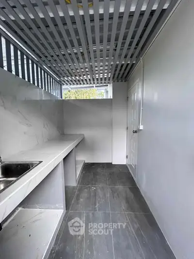 Modern minimalist kitchen with sleek countertops and open layout design